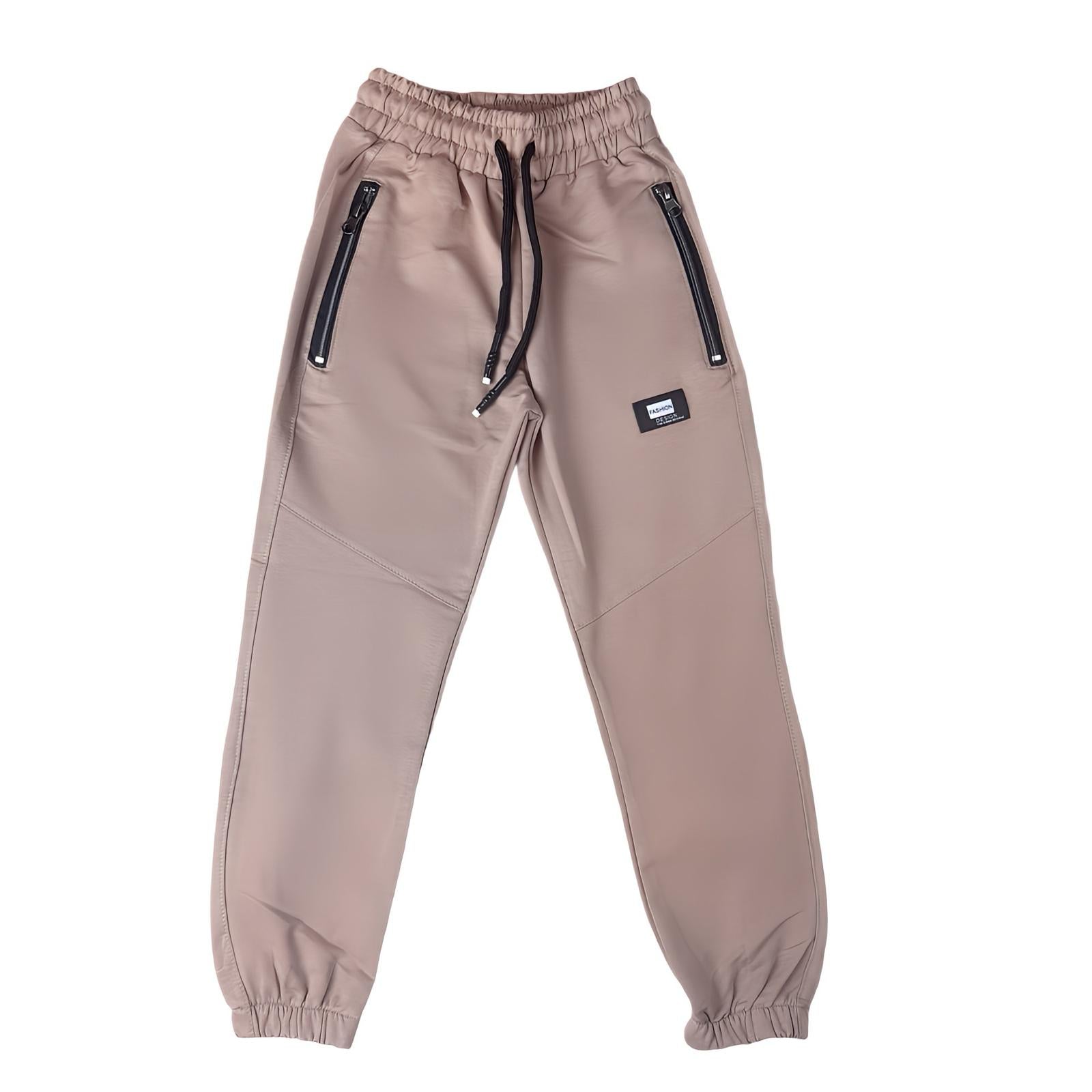 Boys' tracksuit bottoms - practical and modern design (Sizes 110-134)