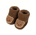 Knitted baby shoes with a teddy bear motif