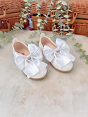Children's patent leather ballerinas with a bow