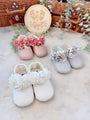 Edle Babyschuhe mit floralen Details