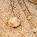 Winter knitted overalls for babies with a hood