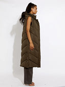 Longline vest with hood and high collar 